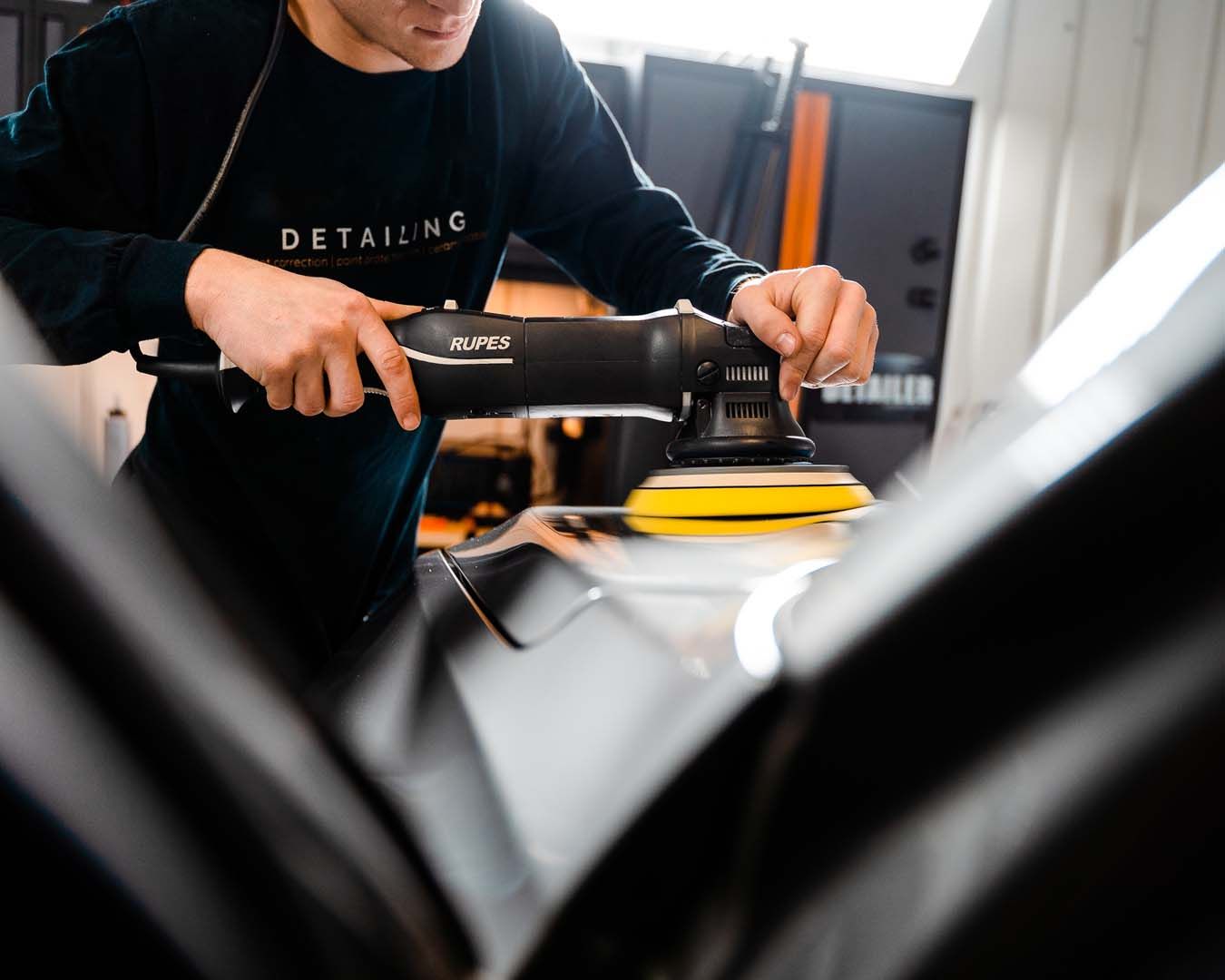Buffing a black hood to a mirror finish before ceramic coating application